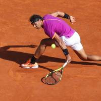 Rafael Nadal hits a shot during his match against David Goffin on Saturday in Monaco. Umpire's ruling mars Nadal's semifinal victory over Goffin