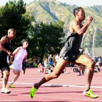 Abdul Hakim Sani Brown sprints in the men\'s 200-meter race at the Bryan Clay Invitational in Azusa, California, on Friday. Sani Brown finished first in 20.41 seconds. | KYODO