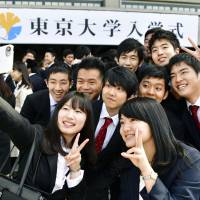 Freshmen at the University of Tokyo gather for a photograph ahead of their entrance ceremony Wednesday at the Nippon Budokan Hall in Tokyo. During the ceremony, Nobel Prize-winning microbiologist and Todai alumnus Yoshinori Ohsumi gave a congratulatory speech. | KYODO