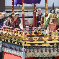 Performers show off a traditional mechanized puppet atop a festival float as the two-day Takayama Spring Festival in Takayama, Gifu Prefecture, kicked off Friday. In December the festival was designated as a UNESCO intangible cultural heritage event. | KYODO