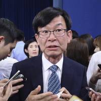 Kim Sang-jo, an economist, talks with reporters after a press conference at the presidential Blue House in Seoul May 17. Kim has advocated for shareholder rights and reforming the chaebol, the family-controlled big businesses that dominate South Korea. President Moon Jae-in has named the long-time shareholder rights advocate to lead the country’s antitrust regulator. Big South Korean firms keeping low profile ahead of Moon's reform quest