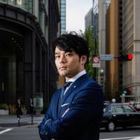 Makoto Yamada, head of equity trading at SMBC Nikko Securities, poses for a photograph in Tokyo in April. The brokerage went from a ¥500 million equity trading loss in fiscal 2011 to a ¥17 billion gain in the last fiscal year. Why ex-Goldman trader shunned hedge funds for a Japan broker