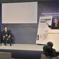Eric Johnston (right), deputy manager of The Japan Times\' domestic news division, moderates a seminar entitled \"Trump Diplomacy &#8212; The View from Asia\" on the sidelines of the Asian Development Bank\'s annual conference in Yokohama on Saturday. | YOSHIAKI MIURA