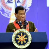 Philippine President Rodrigo Duterte delivers a speech during the 33rd National Convention of the Philippine Coast Guard Auxiliary (PCGA) in Davao City on the southern island of Mindanao on Friday. | AFP-JIJI