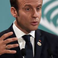 French President Emmanuel Macron attends a news conference at the end of the Group of Seven summit of industrialized nations in Taormina, Sicily, on Saturday. | AFP-JIJI