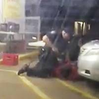 In this  July 5, 2016, image made from video, Alton Sterling is restrained by two Baton Rouge police officers, one holding a gun, outside a convenience store in Baton Rouge, Louisiana. Moments later, one of the officers shot and killed Sterling, a black man who had been selling CDs outside the store, while he was on the ground. Officers Blane Salamoni and Howie Lake II were placed on administrative leave. | ARTHUR REED / VIA AP