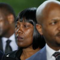Sandra Sterling, aunt of Alton Sterling, listens as family and attorneys speak following a meeting with the U.S. Justice Department at federal court in Baton Rouge, Louisiana, Wednesday. The Justice Department has decided not to charge two white Baton Rouge police officers in the fatal shooting of Sterling, whose death was captured on cell phone video, fueling protests in Louisiana\'s capital and beyond. | AP