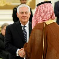 U.S. Secretary of State Rex Tillerson shakes hands with a participant as he attends a signing ceremony between U.S. President Donald Trump and Saudi Arabia\'s King Salman bin Abdul-Aziz al-Saud Salman at the Royal Court in Riyadh on May 20. | REUTERS