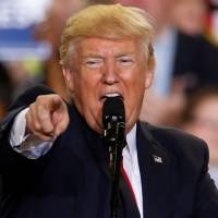 U.S. President Donald Trump appears on stage at a rally in Harrisburg, Pennsylvania, on Saturday. | REUTERS