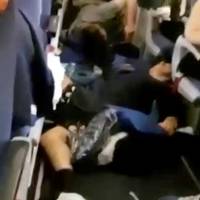 A still image from video shows passengers lying on the floor and debris in plane cabin onboard an Aeroflot Boeing 777 flight from Moscow to Bangkok after it hit turbulence Monday. Sudden severe turbulence injures 27 on Aeroflot flight approaching Bangkok