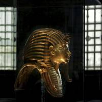 The solid gold mask of King Tutankhamun is seen in its glass case in the Egyptian Museum in central Cairo in 2013. Experts meet in Egypt to discuss moving King Tutankhamun's gold mask and other artifacts