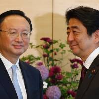 China\'s State Councilor Yang Jiechi meets with Prime Minister Shinzo Abe at the Prime Minister\'s Office in Tokyo on Wednesday. | AFP-JIJI