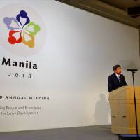 Asian Development Bank President Takehiko Nakao addresses attendees at  the bank’s 50th annual meeting at Pacifico Yokohama on Sunday. | SHUSUKE MURAI