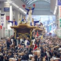 Wooden floats are pulled during the Kishiwada Danjiri Festival in Kishiwada, Osaka Prefecture, in this undated file photo. | KYODO