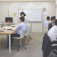 Students with developmental disabilities study how to plan and prioritize their work at Teens in Tokyo’s Shinjuku Ward. | SATOKO KAWASAKI