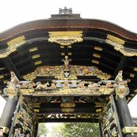 Tourists take photos of Nishi Honganji Temple\'s Karamon gate in Kyoto on Sunday. The decorative gate was opened for the first time in 34 years to mark the birthday of Shinran, a 12th century monk who founded the Jodo Shinshu school of Buddhism. | KYODO