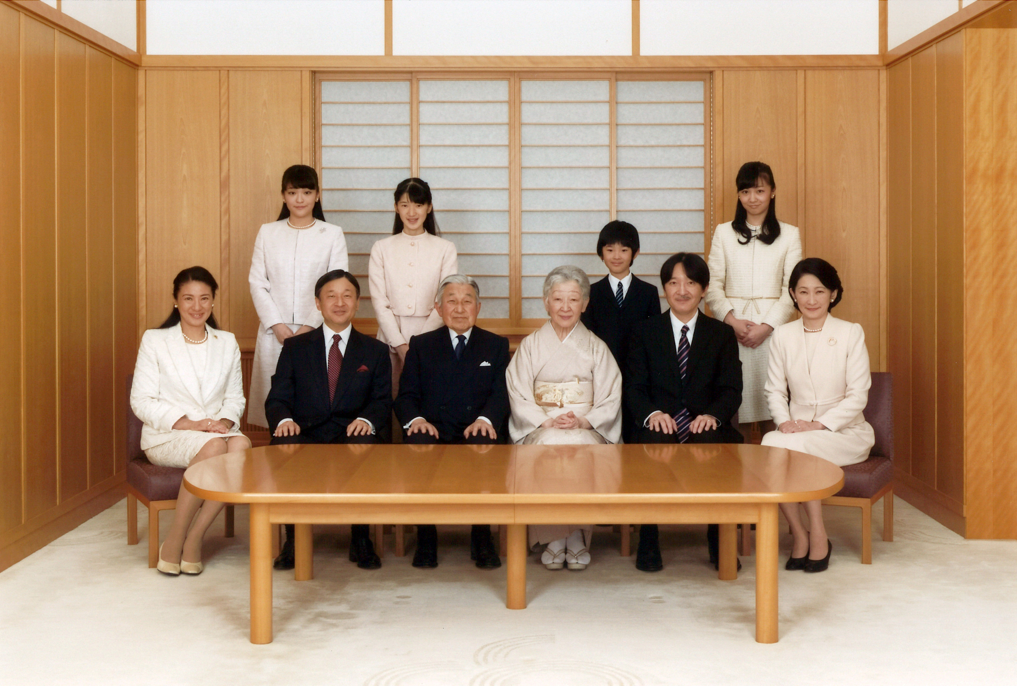 Emperor Akihito and Empress Michiko pose with their family members during a photo session at the Imperial Palace in Tokyo in 2016. | REUTERS