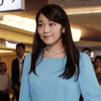 Princess Mako leaves for Bhutan at Haneda airport on Wednesday in Tokyo. | AP