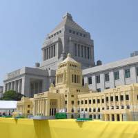 A miniature replica of the Diet made of Lego blocks is displayed in the front yard of the House of Councilors on Saturday to mark the 70th anniversary of the upper chamber\'s founding. | KYODO