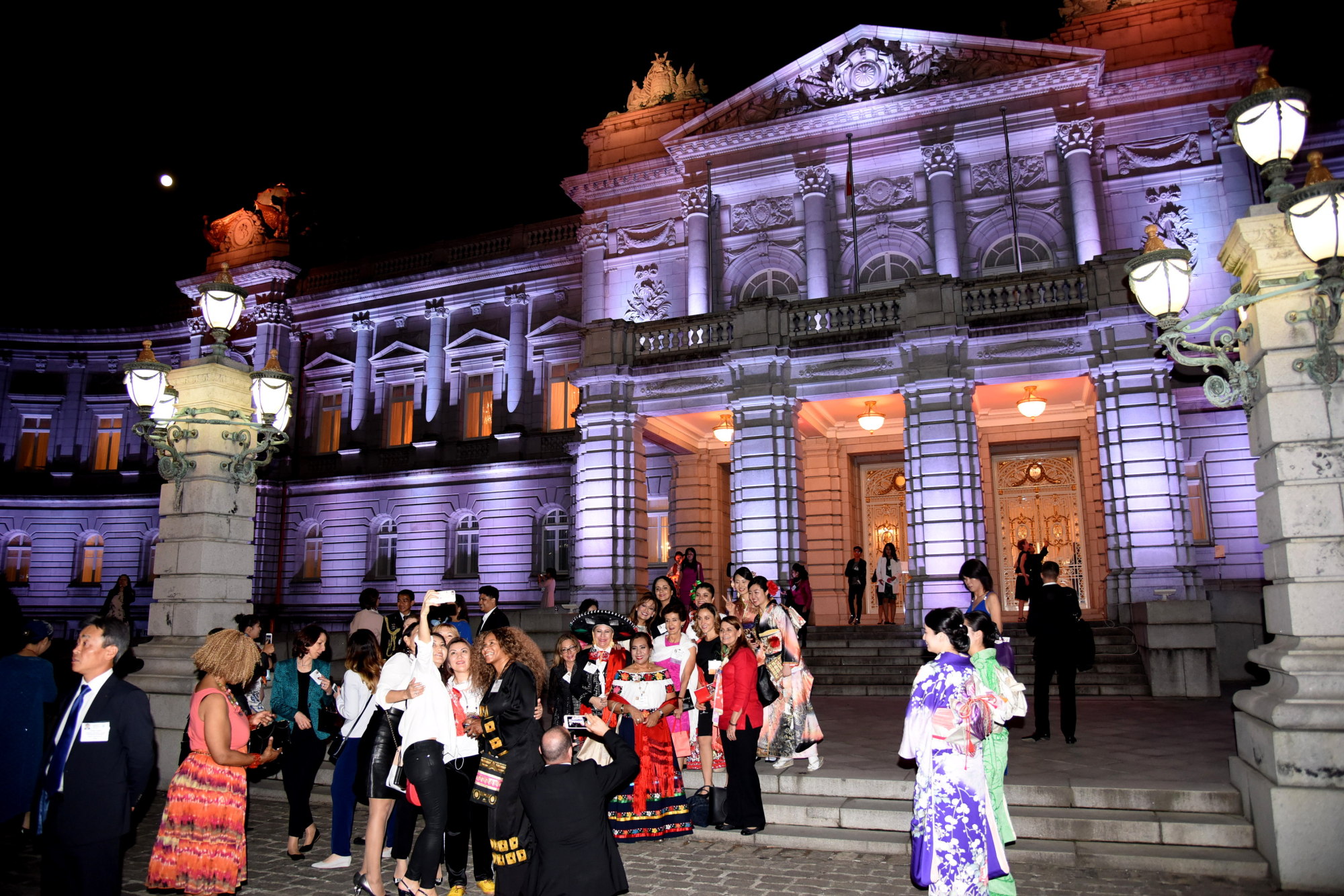 Participants take pictures at the Government Guesthouse in Akasaka, Tokyo, last Thursday during the Global Summit of Women's welcoming dinner. | SATOKO KAWASAKI