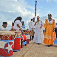Guardians of culture: Members of La Caridad de Oriente prepare to perform the Tumba Francesa atop San Pedro de la Roca castle in Santiago de Cuba. Looking for 'omotenashi' in Cuba's southeast