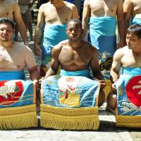 Tim Franklin is flanked by fellow sumo wrestlers during his spell in Okinawa on the JET Programme. Thirty years of JET: countless treasured memories and priceless gaffes