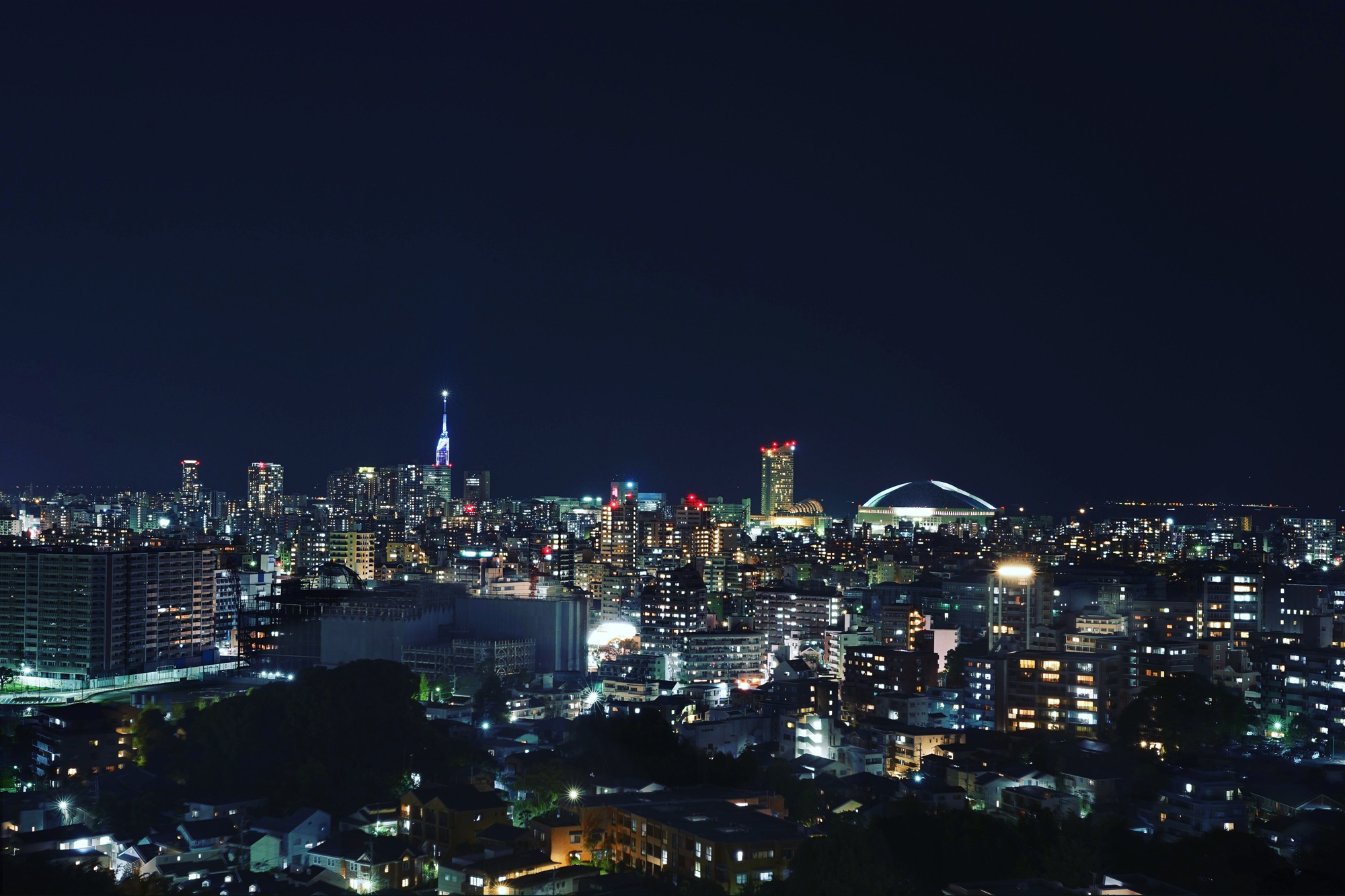 Boomtown: The city at night, with Fukuoka Tower, the city's tallest building, and Fukuoka Dome lit up. | OSCAR BOYD