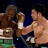 Ryota Murata (right) hits Hassan N\'Dam during their middleweight title bout on Saturday. | AFP-JIJI
