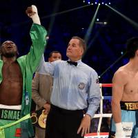 Ryota Murata (right) and Hassan N\'Dam react after hearing the judges\' scores after their title fight. | AFP-JIJI