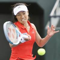 Kimiko Date hits a shot during her first-round match on Wednesday in Gifu. | KYODO