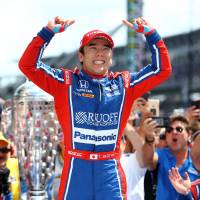 IndyCar Series driver Takuma Sato celebrates after winning the 101st Running of the Indianapolis 500 at Indianapolis Motor Speedway Sunday. Takuma Sato becomes first Japanese to win Indianapolis 500