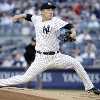 New York’s Masahiro Tanaka pitches against Oakland in the first inning on Friday night at Yankee Stadium. Yankees fall despite strong performance from Tanaka