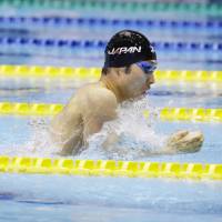 Kosuke Hagino dominates the field en route to victory in the men\'s 200-meter individual medley at the Japan Open on Sunday at Tatsumi International Swimming Center. | KYODO