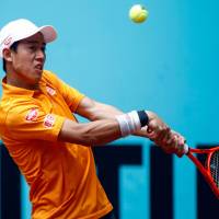 Kei Nishikori plays a shot during his third-round match against David Ferrer at the Madrid Open on Thursday. | AFP-JIJI