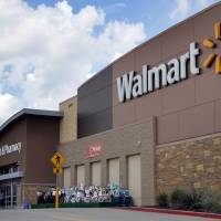 People walk in and out of a Walmart store in Dallas in August 2016. Online merchants wary of Amazon feel warm embrace of . . . Wal-Mart?