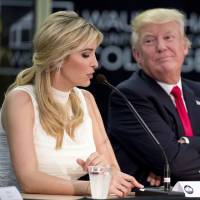 U.S. President Donald Trump listens as his daughter Ivanka speaks at a workforce development roundtable at Waukesha County Technical College in Wisconson on Tuesday. | AP