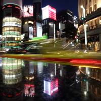 Buildings and streets are illuminated in the Ginza shopping district in Tokyo. The lights of the district\'s high-end boutiques and bars may someday be powered by coal burned more than 2,700 km away in Mongolia. | BLOOMBERG