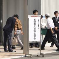 People enter a Sharp Corp. shareholders meeting in Sakai, Osaka Prefecture, on Tuesday. | KYODO
