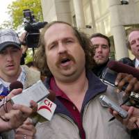 Kirk Jones talks to reporters after being released from custody in St. Catherines, Ontario, on Oct. 23, 2003, after surviving a plunge over Niagara Falls. Niagara Falls daredevil riding inside inflatable ball with a boa constrictor dies; snake missing