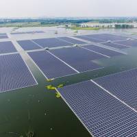 The world’s largest floating solar power plant is seen on a lake in Huainan, in China’s central Anhui province, on Wednesday. Floating solar farm reflects China's clean energy ambitions