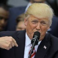 U.S. President Donald Trump welcomes the Clemson Tigers, 2016 NCAA Football National Champions, to the White House on Monday. | REUTERS