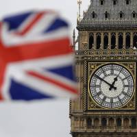 The Big Ben clock tower stands in front of the Houses of Parliament in London. | AP