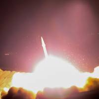 A handout picture provided by the Iran’s state TV (IRIB) official website and released on Sunday shows Iranian revolutionary guards Corps (IRGC) launching a missile from an undisclosed location in western Iran, toward Islamic State (IS) bases in Syria. Iran's Revolutionary Guard fires missiles into Islamic State targets in Syria over Tehran attacks