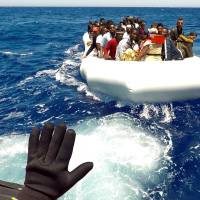 Migrants are rescued by Save the Children NGO crew from the ship Vos Hestia in the Mediterranean sea off Libya Thursday. | REUTERS