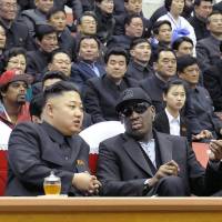 North Korean leader Kim Jong Un and former NBA star Dennis Rodman speak at a basketball game in Pyongyang on Feb. 28, 2013. | AFP-JIJI