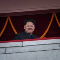 North Korean leader Kim Jong-Un looks out on  Kim Il Sung Square during a mass military parade in Pyongyang. on Oct. 10, 2015. | AFP-JIJI
