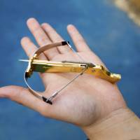 A Chinese boy displays a toothpick crossbow in Yangzhou on June 24. China quickly pulls 'time-bomb' crossbows from toy store shelves