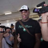 Former NBA basketball player Dennis Rodman exits the arrival gate at Beijing’s international airport on Saturday after returning from North Korea. Ex-NBA star Rodman wraps up 'very good trip' to North Korea, is cryptic on Kim meeting