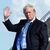 U.S. President Donald Trump arrives at Newark International airport in New Jersey on Friday to spend a weekend at Trump National Golf Club in Bedminister, New Jersey. | REUTERS