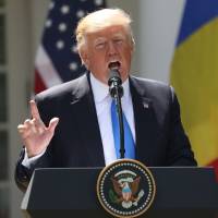 U.S. President Donald Trump speaks during a news conference Friday in the Rose Garden at the White House in Washington. | AP